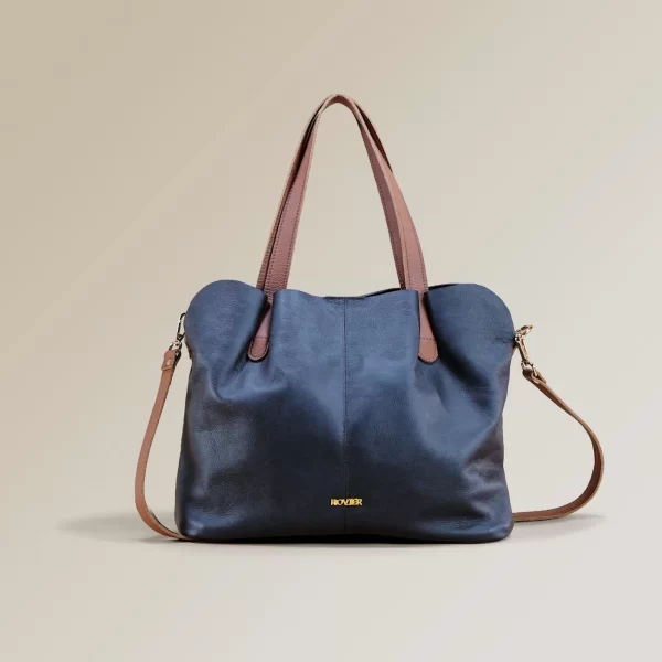 bolso de cuero genuino, bolso de cuero floater, bolso de cuero vacuno, bolso de cuero para mujer, bolso de cuero negro con tiros cafés, bolso de cuero flexible, bolso de cuero personalizado, bolso de cuero boliviano, marroquinería de Bolivia, bolso de cuero elegante, bolso de cuero exclusivo.
